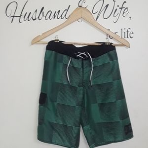 Boys size 10 DC brand green & black swim trunk. 🏊